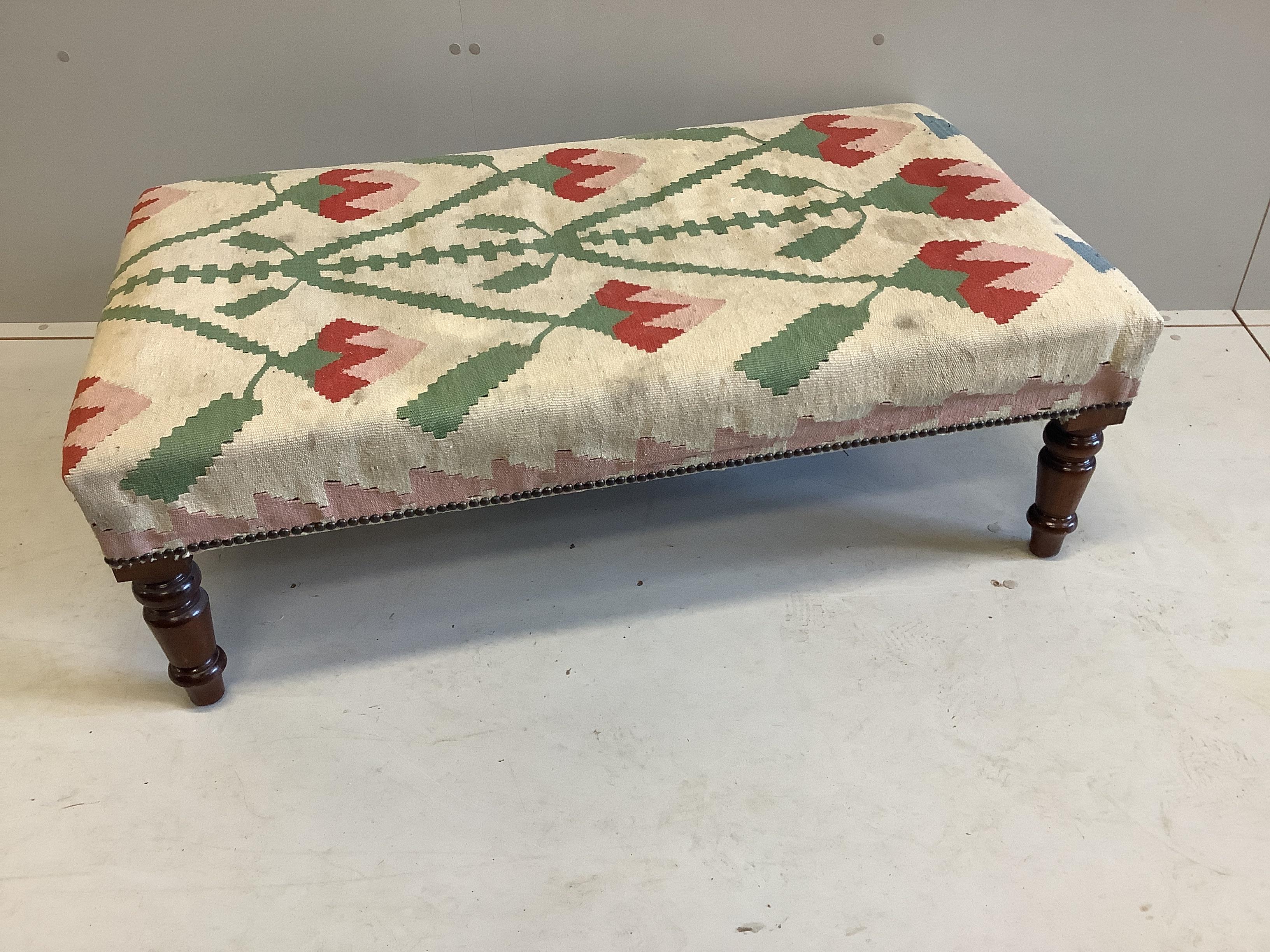 A Victorian style rectangular stool with Kilim covered seat on turned mahogany legs, width 111cm, depth 62cm, height 36cm